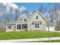 Beautiful two-story home featuring well-maintained landscaping and gray accents at 10756 Dartmoor Way, Zionsville, IN 46077