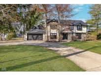 Charming two-story home featuring a stone facade, attached garage, and a well-manicured front lawn at 112 Wesley Cir, Noblesville, IN 46062