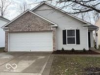 Charming single-story home with a brick facade and two-car garage at 1197 N Aberdeen Dr, Franklin, IN 46131