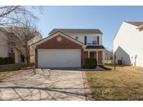Two-story home featuring brick and siding, attached two car garage, and manicured lawn at 15405 Fawn Meadow Dr, Noblesville, IN 46060