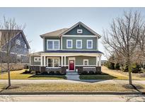 Charming two-story home featuring a inviting front porch, well-manicured lawn and appealing curb appeal at 1591 W 151St St, Westfield, IN 46074