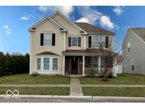 Charming two-story home featuring neutral siding, black shutters, and a welcoming front porch at 3432 Shepperton Blvd, Indianapolis, IN 46228