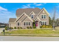 Attractive brick home featuring a manicured lawn and inviting curb appeal at 5842 Oakmont Blvd, Bargersville, IN 46106