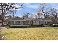 Charming single-story home with well-maintained lawn, mature trees, and inviting curb appeal at 6101 Crows Nest Dr, Indianapolis, IN 46228