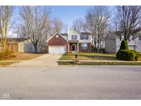 Charming two-story home featuring a brick facade and well-maintained front yard at 6144 Maple Branch Pl, Indianapolis, IN 46221