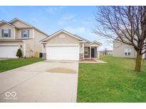 Inviting single-Gathering home featuring a two-car garage and well-maintained lawn at 7726 Belmac Ln, Camby, IN 46113