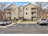 Inviting multi-Gathering condo features a landscaped entrance, reserved parking, and private balconies at 8820 Yardley Ct # Apt 309, Indianapolis, IN 46268