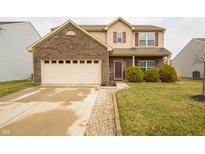 Two-story home boasts brick and vinyl siding, attached two-car garage, and well-maintained lawn at 892 Sommersweet Run, Greenwood, IN 46143
