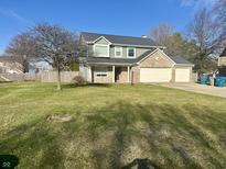 Charming two-story home featuring a brick facade and a well-manicured lawn at 113 Spring Creek Ct, Noblesville, IN 46062