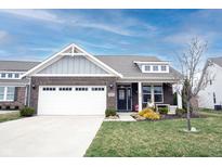 Charming single-story home featuring a brick facade, well-manicured lawn, and an attached two-car garage at 19252 Chestnut Grove Ln, Noblesville, IN 46062