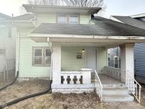 Charming home featuring a covered front porch with white brick pillars at 3554 Graceland Ave, Indianapolis, IN 46208