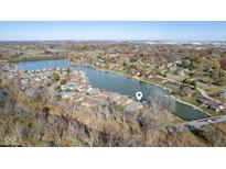 Beautiful aerial view of lakeside homes with private boat docks and autumn foliage at 5901 Crystal Bay West Dr, Plainfield, IN 46168