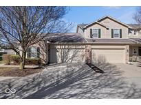 Charming home featuring a two-car garage, brick accents, and well-maintained landscaping at 7236 Wyatt Ln, Indianapolis, IN 46217