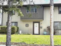 Charming townhome with a well-manicured lawn and inviting front entrance at 7902 Benjamin Dr, Lawrence, IN 46226