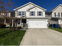 Charming two-story home with a wide driveway and attached two-car garage at 15503 Sandlands Cir, Noblesville, IN 46060