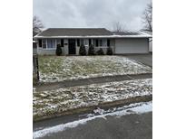 Charming single-story home with well-manicured lawn and attached two-car garage at 4126 Flamingo West Dr, Indianapolis, IN 46226
