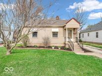 Charming single-Gathering home featuring a well-maintained lawn and inviting front entrance at 5534 Speedway Dr, Indianapolis, IN 46224