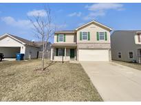 Charming two-story home featuring a two-car garage, green shutters, and a well-maintained front yard at 5908 Sable Dr, Indianapolis, IN 46221