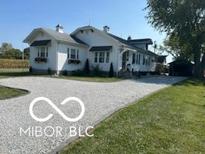 Charming, cottage-style home with gravel driveway and well-manicured lawn in a quiet, rural setting at 5951 W St Rd 32 W, Anderson, IN 46011