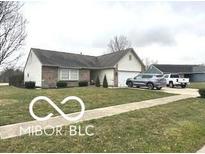 Well-maintained single-story home with a two-car garage and tidy front lawn and driveway at 1001 Maple W Dr, Lebanon, IN 46052