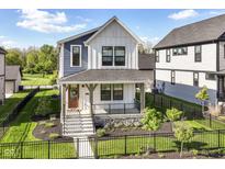 Attractive two-story home featuring a well-manicured lawn and inviting front entrance at 11505 Langton Walk, Zionsville, IN 46077