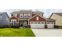 Beautiful two-story home with a well-manicured lawn and a spacious two-car garage, creating curb appeal at 11925 Piney Glade Rd, Noblesville, IN 46060