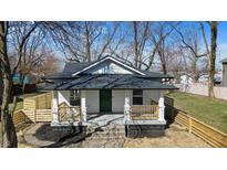 Charming renovated home with a inviting front porch and newly landscaped yard at 1822 N Dexter St, Indianapolis, IN 46202