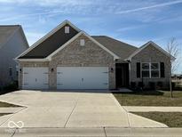 Charming single-story home featuring a brick facade and a spacious two-car garage at 3581 Free Spirit Ct, Westfield, IN 46074