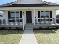 Charming single-story home featuring a covered front porch and freshly landscaped yard at 769 E Pearl St, Whiteland, IN 46184