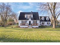 Charming two-story home with a classic design and a well-maintained front yard at 9531 Prospect St, Indianapolis, IN 46239