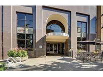 Beautiful exterior view of the building with large windows and outdoor seating area at 110 E Washington St # 802, Indianapolis, IN 46204