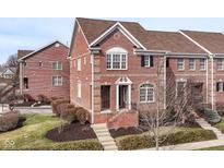 Charming brick townhome with manicured lawn and inviting front entrance at 13082 Overview Dr # 5A, Fishers, IN 46037
