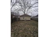 Spacious backyard featuring a lawn and a fenced perimeter, great for outdoor activities at 1410 St Paul St, Indianapolis, IN 46203