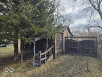 Exterior view of a backyard featuring a shed and privacy fence at 312 N Grafton Ave, Muncie, IN 47303