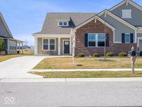 A charming home with a well-manicured lawn and an inviting front porch, set in a quiet neighborhood at 3252 Jasper Ln, Brownsburg, IN 46112