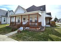 Charming home with a spacious front porch and well-maintained landscaping at 331 Colescott St, Shelbyville, IN 46176
