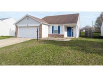 Charming one-story home featuring a well-manicured front yard and attached garage at 11403 Fairweather Pl, Indianapolis, IN 46229