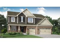 Charming two-story home featuring a brick-and-siding facade and a two-car garage at 11654 Aubrey Ln, Fishers, IN 46040