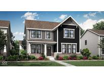 Charming two-story home featuring a mix of gray and black siding, brick accents, and a welcoming front porch at 20147 Chad Hittle Blvd, Westfield, IN 46074