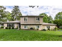 Charming two-story home featuring stone accents and well-maintained landscaping at 4528 Brookshire Pkwy, Carmel, IN 46033