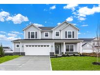 Charming two-story home with gray siding, black shutters, and a well-manicured lawn at 5777 Greenbrier Ct, Brownsburg, IN 46112