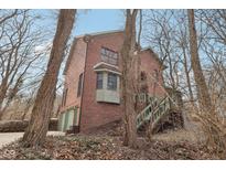 Stunning brick home featuring attached garage and charming green accents at 6535 Wings Ct, Brownsburg, IN 46112