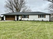 Charming single-story home featuring a well-manicured lawn and inviting exterior accents at 7874 E County Road 200 N, Avon, IN 46123