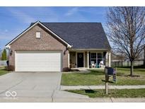 Charming single-Gathering home features a well-manicured lawn and attached garage at 1905 Collingwood Dr, Avon, IN 46123