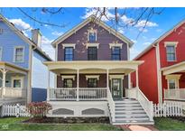 Charming two-story home with a welcoming front porch and colorful siding in a vibrant neighborhood at 2037 Rhettsbury St, Carmel, IN 46032
