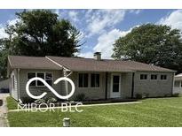 Charming single-story home featuring a well-maintained lawn and inviting front entrance at 4904 Betholm Dr, Indianapolis, IN 46239