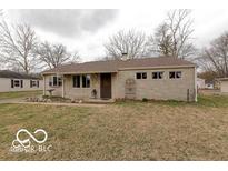 Charming single-story home featuring stone facade and well-maintained front yard landscaping at 4904 Betholm Dr, Indianapolis, IN 46239