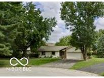 Charming single story home with attached garage, mature trees, and well-maintained landscaping at 110 Leichester Ct, Noblesville, IN 46060