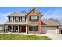 Charming two-story home with a brick facade, covered porch, and well-maintained lawn at 17918 Lucas Cir, Westfield, IN 46074