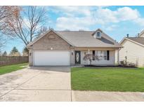 Charming single-story home featuring a well-maintained lawn, attached garage, and inviting curb appeal at 2425 Silver E Ct, Carmel, IN 46033